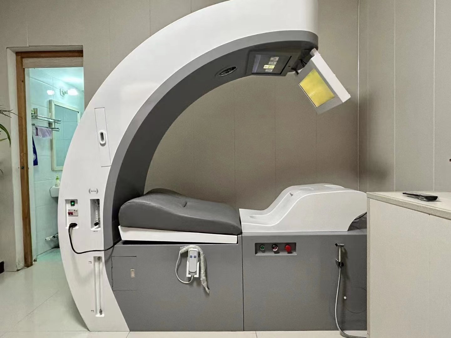 Modern colon hydrotherapy equipment in clinical setting showing pricing factors